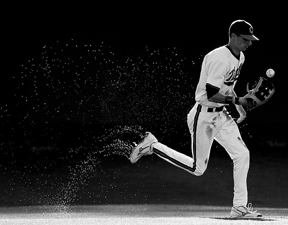 Clemson University outfield Will Lamb tosses the ball in his glove after catching a fly ball in the Tiger's game against University of South Carolina in Clemson Sunday afternoon.