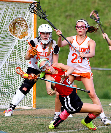 Nation Ford High School's Megan Gallagher loses her grip on her stick while being defended by Mauldin High School's Kate Teodosio in the first half of their game at Mauldin Thursday evening, April 21,